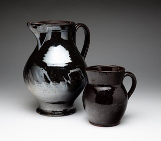 TWO POTTERY PITCHERS.