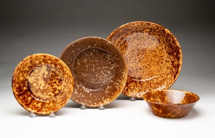 FOUR YELLOW WARE BOWLS.