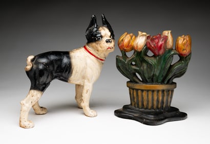 TWO PAINTED FIGURAL CAST IRON DOORSTOPS.