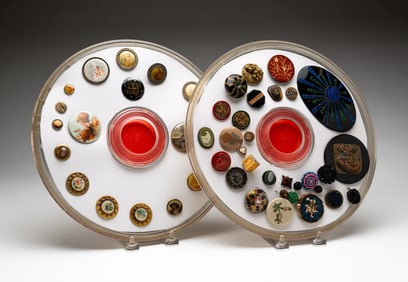 TWO GROUPS OF CELLULOID AND FABRIC COVERED BUTTONS.