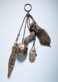 STERLING CHATELAINE WITH UNUSUAL CHARMS.
