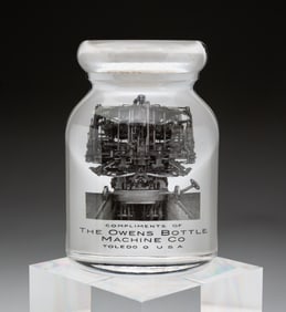 BOTTLE SHAPED ADVERTISING PAPERWEIGHT.