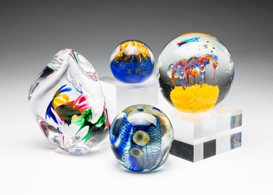 FOUR ART GLASS PAPERWEIGHTS.