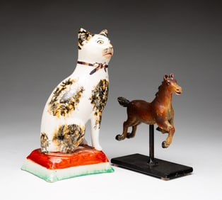 A CARVED HORSE AND STAFFORDSHIRE CAT.