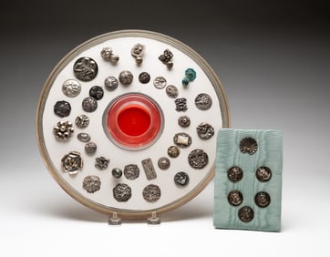 GROUP OF SILVER BUTTONS.