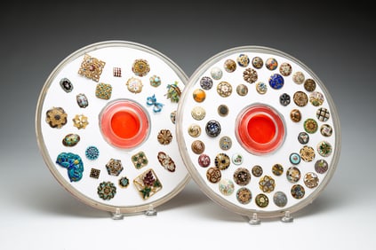 TWO GROUPS OF ENAMEL BUTTONS.