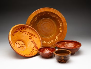 FIVE REDWARE BOWLS.