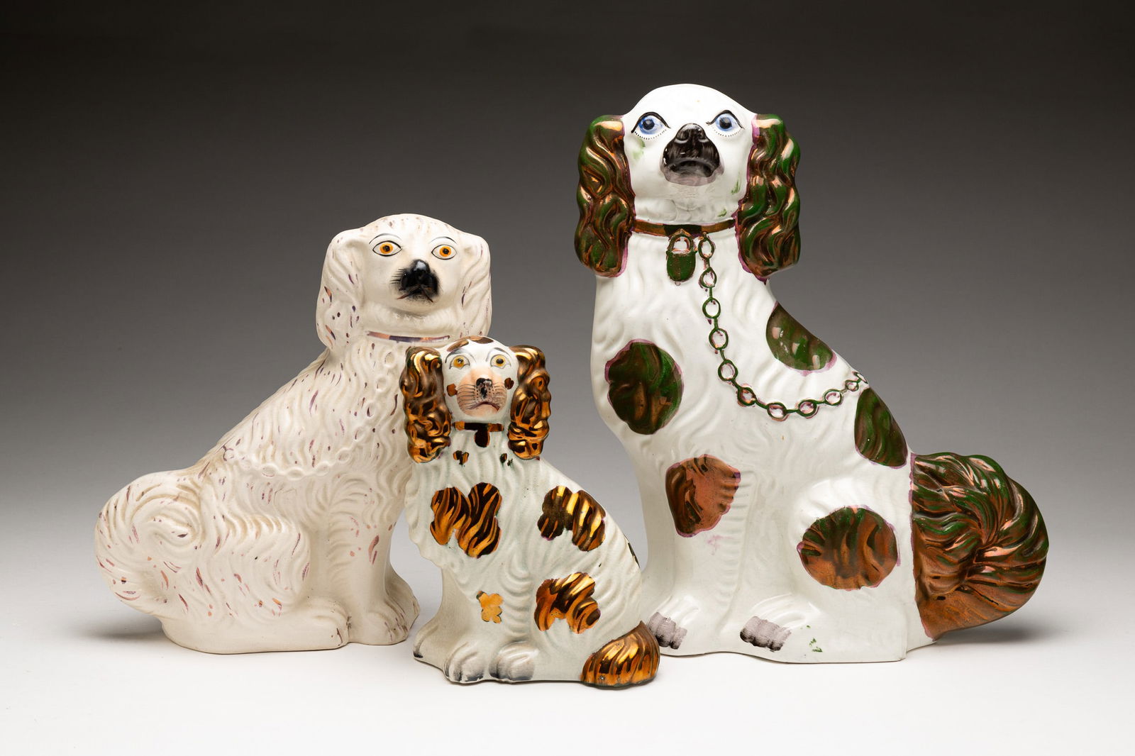 THREE STAFFORDSHIRE SPANIELS. (1 of 6)
