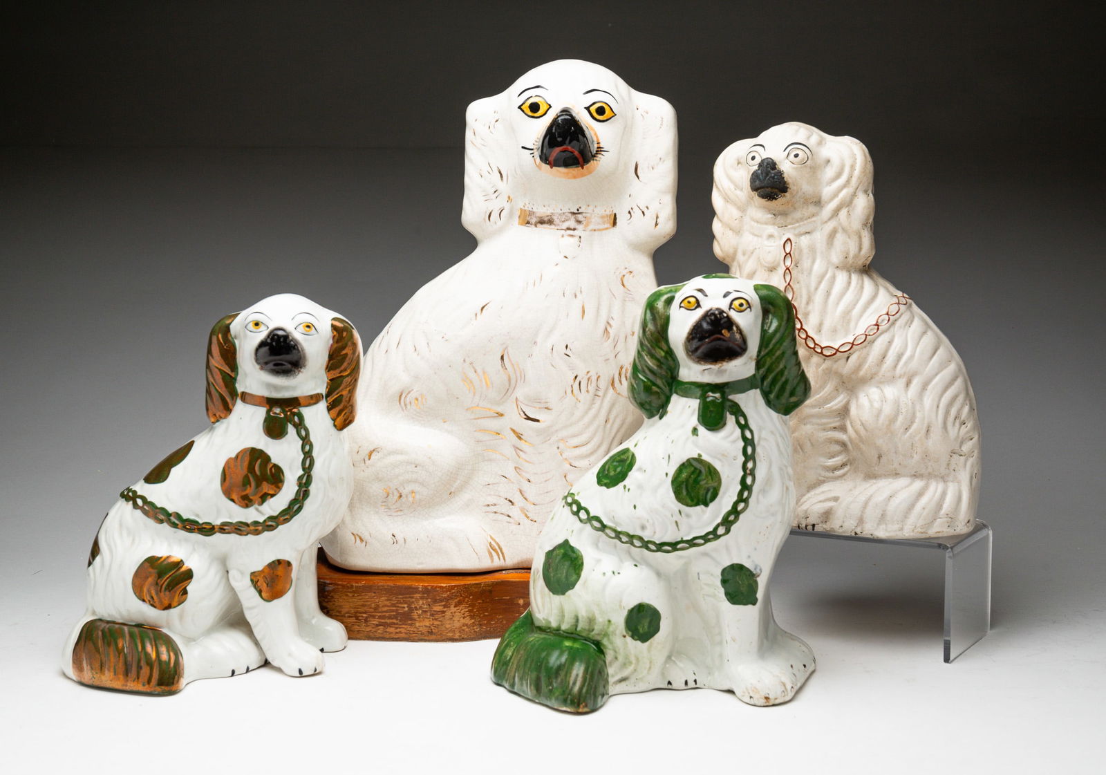 FOUR STAFFORDSHIRE SEATED SPANIELS (1 of 6)