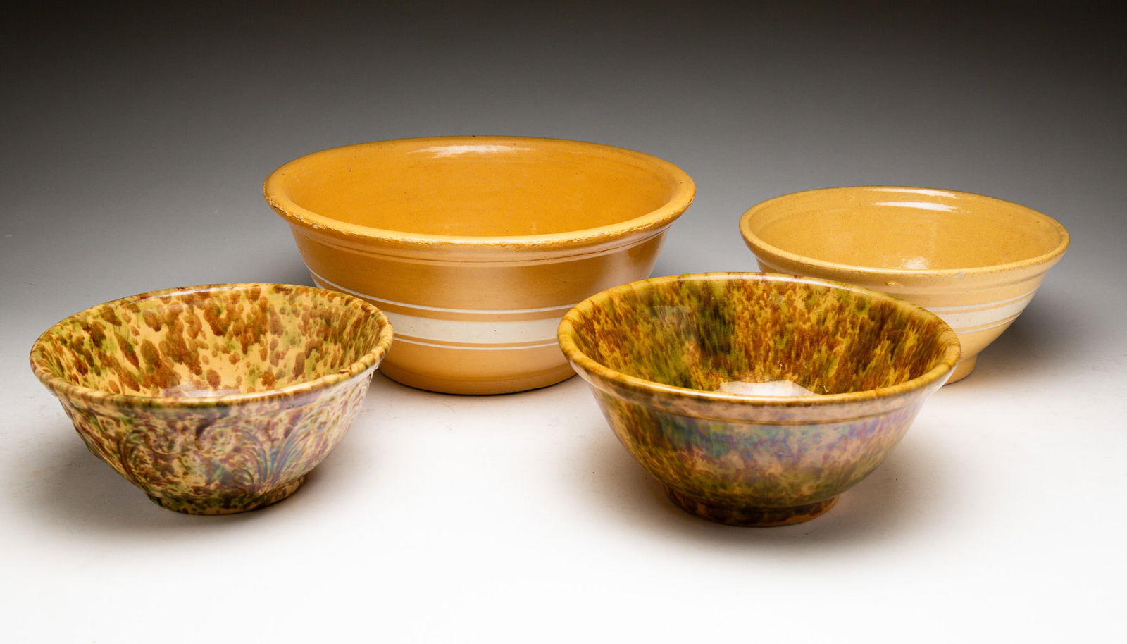FOUR YELLOWWARE BOWLS (1 of 5)