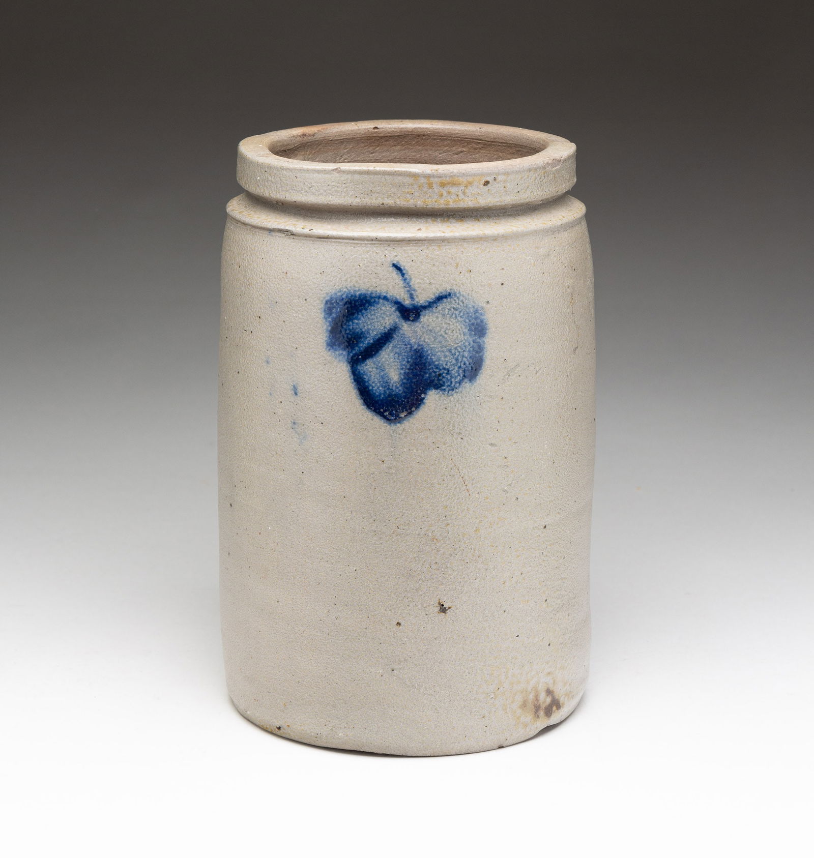STONEWARE JAR WITH COBALT FREEHAND DECORATION.: American, second-half 19th Century. Gray salt glaze with leaf decorations. Rim chips and surface wear. 8.5"h.