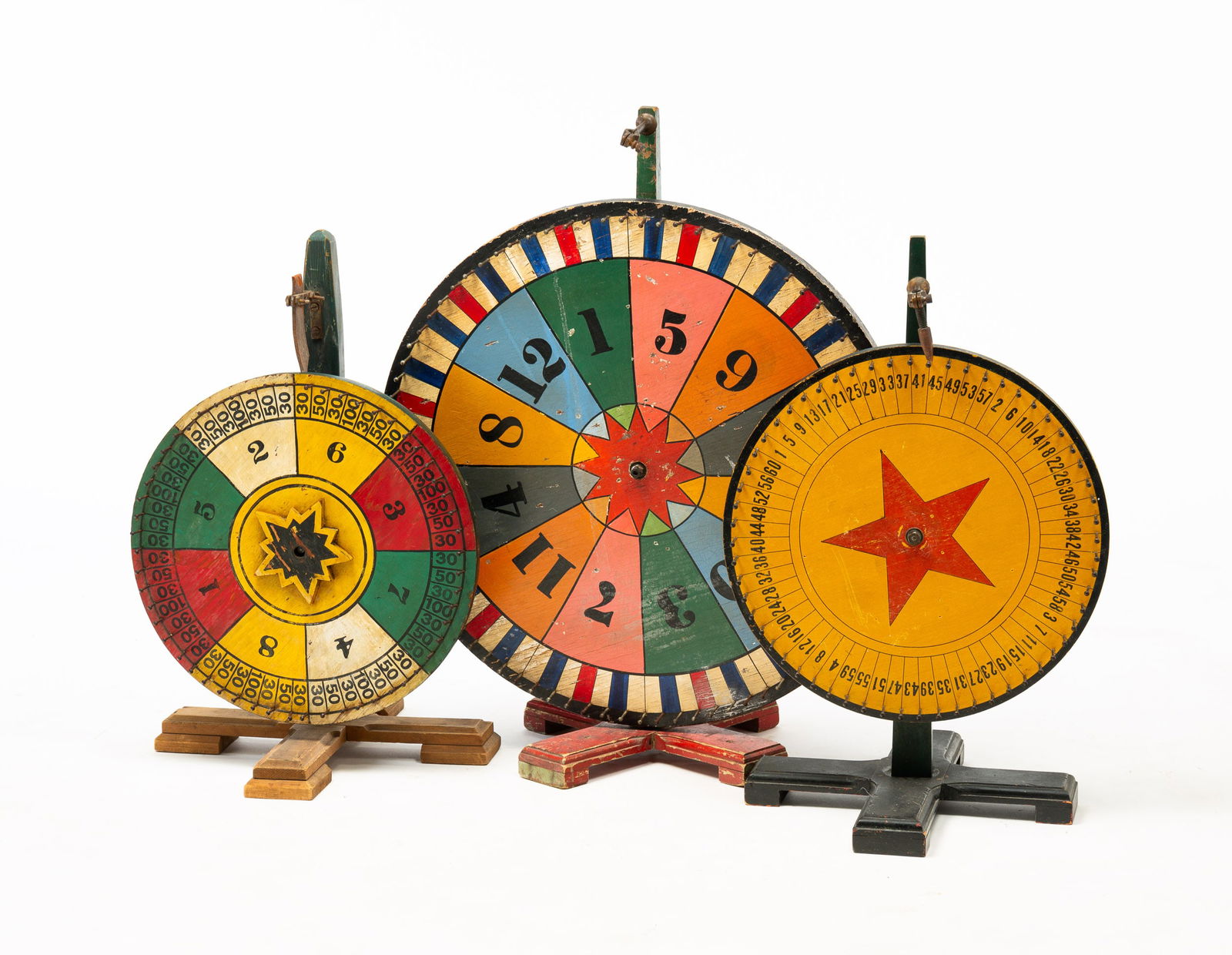 THREE PAINTED GAME WHEELS. (1 of 4)