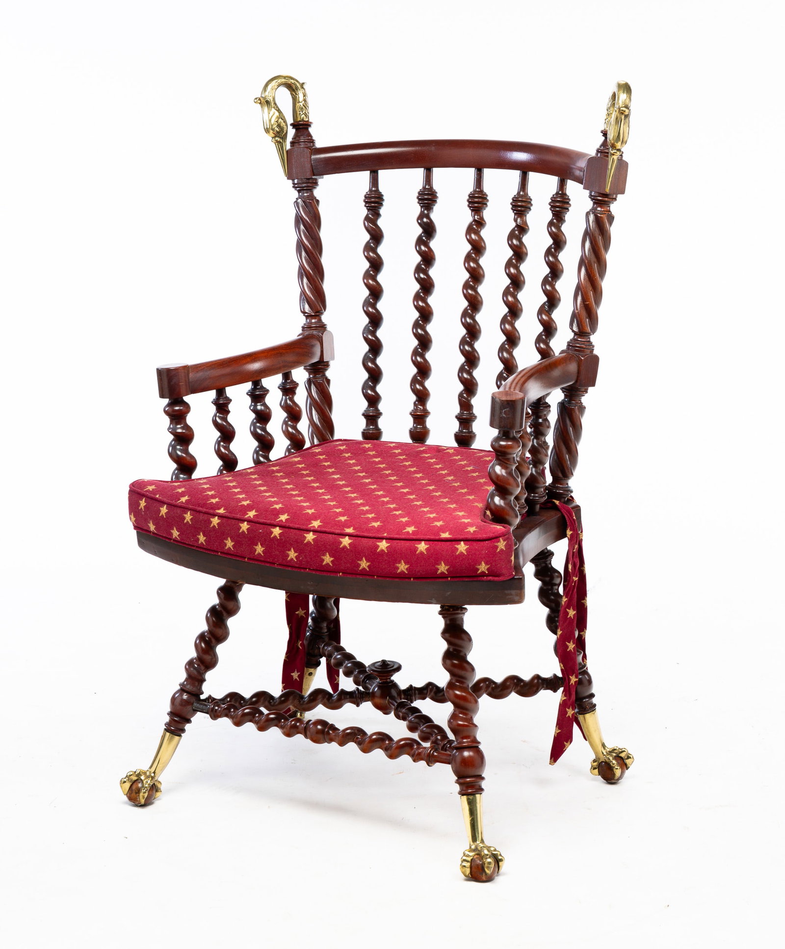 FANCY ARMCHAIR.: American, circa 1900. Southern gum. Rope turned stiles with brass Swan's heads finials, briar twist turned spindles, legs and "X" stretcher with brass claw and wood ball feet. Refinished with newer de