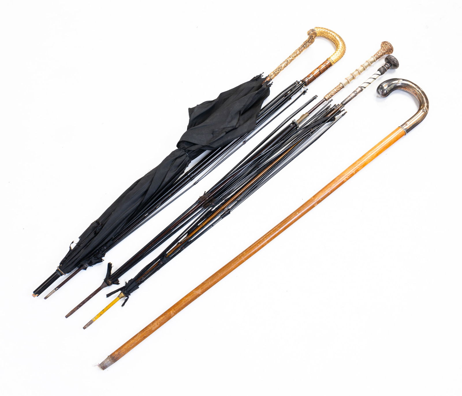 FOUR PARASOLS AND A CANE. (1 of 4)
