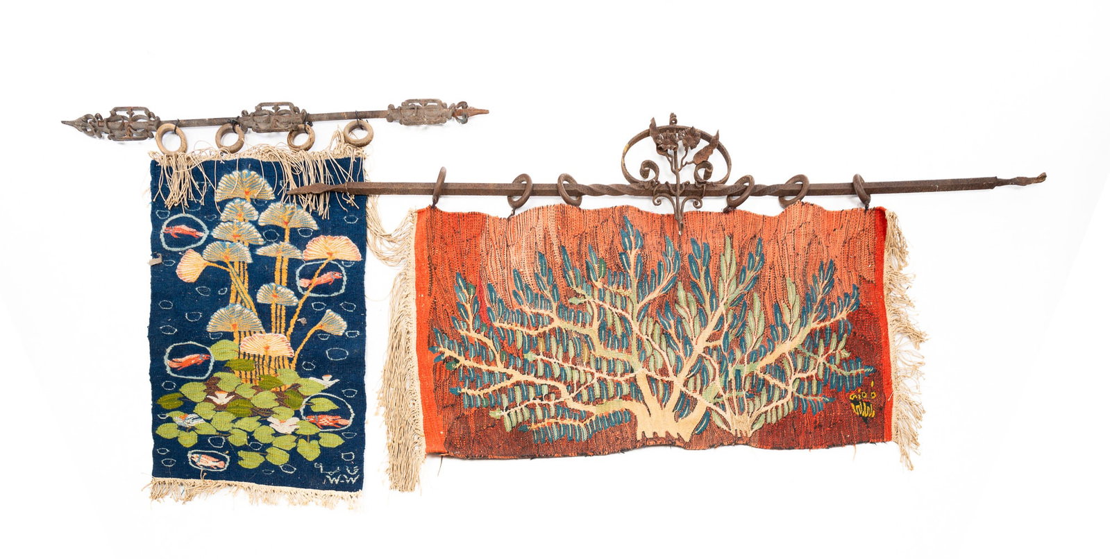 TWO RAMSES WISSA WASSEF TAPESTRIES.: Egyptian, second-quarter 20th Century. Cotton. A tree on a coral background, 22.5"h. 44"w. And papyrus and lily pads on a cobalt background, 30"h. 20.5"w. Both signed W.W. lower right and have iron ha