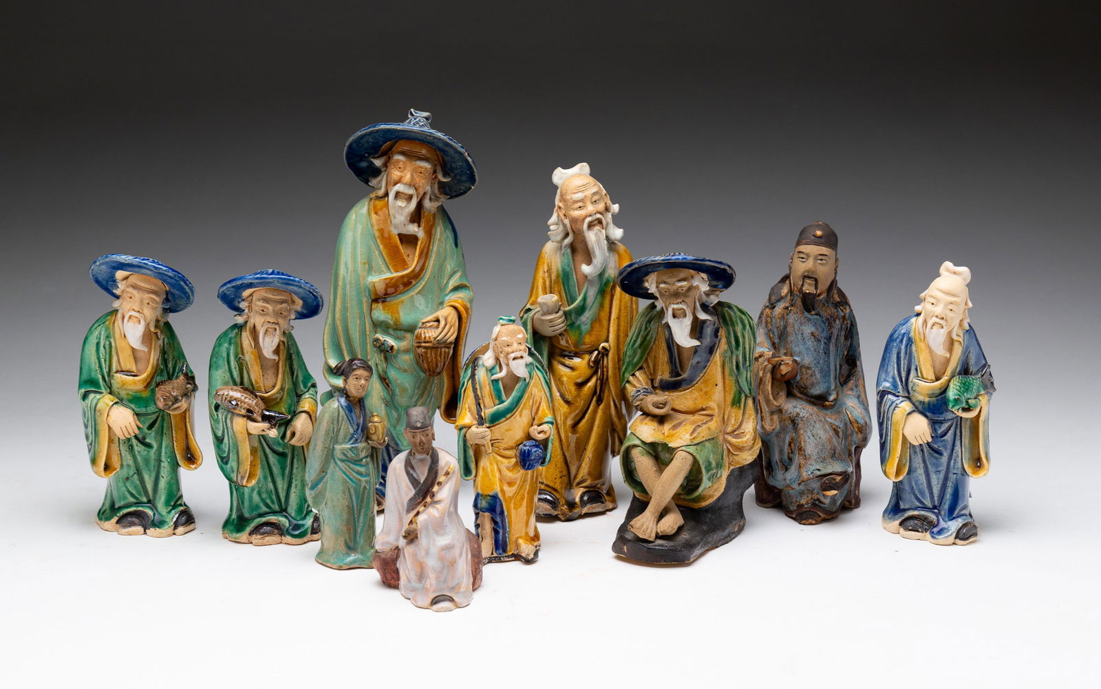 GROUP OF MUD MEN FIGURINES. (1 of 6)