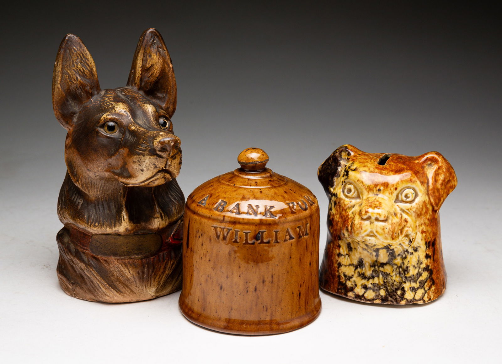 THREE POTTERY BANKS. (1 of 3)