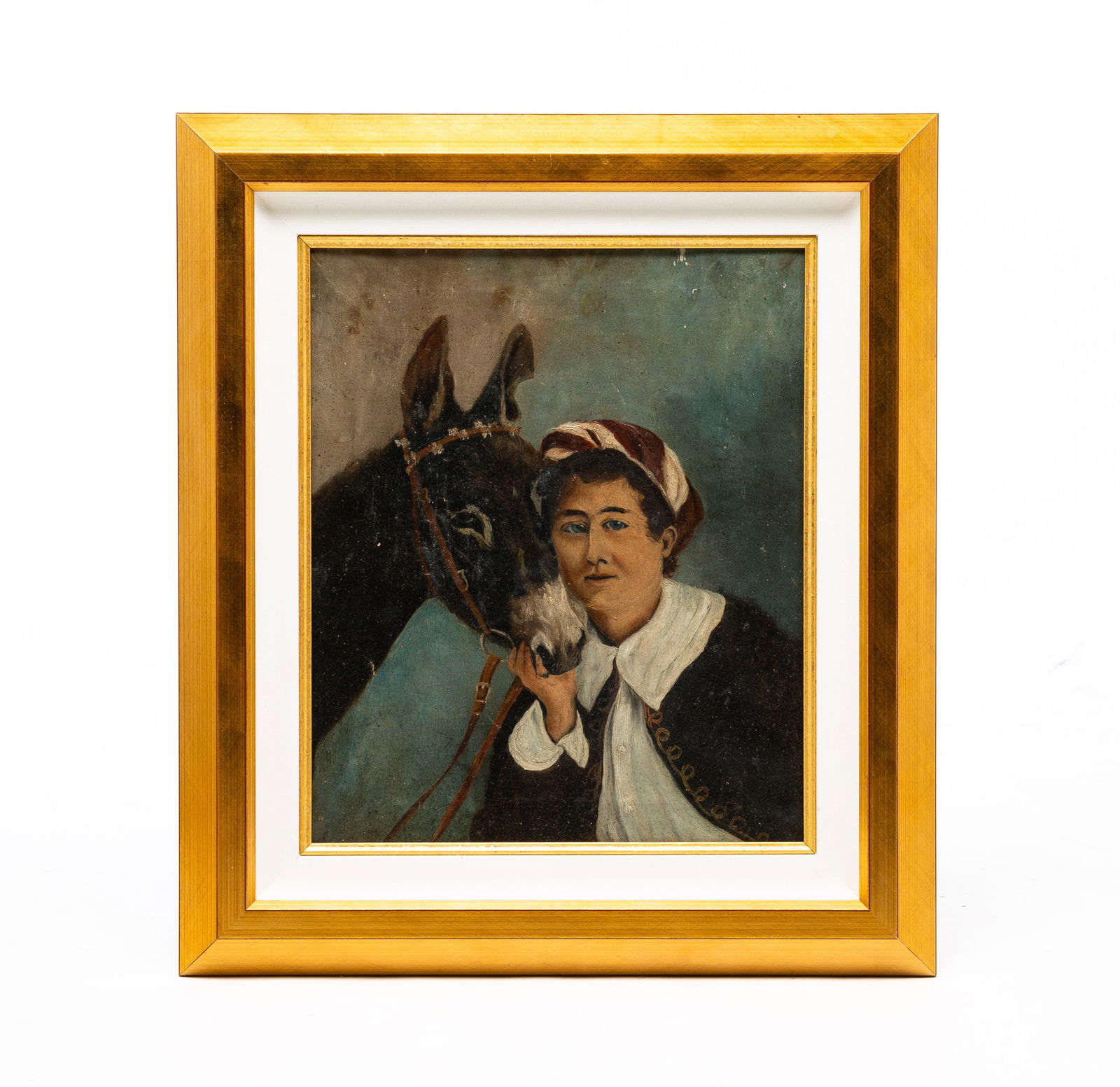 FRAMED OIL ON CANVAS "THE JOCKEY".: American, hirst half 20th century, oil on canvas. Unsigned. Woman holding the face of horse. Tag from showing at the Michigan State Fair in Detroit. Gold frame with linen and gilt liner. Paint flaking