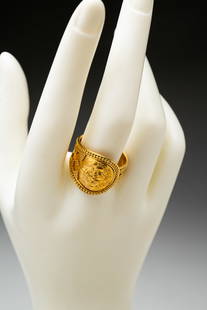 LALAOUNIS 18 KARAT GOLD RING.: Greek, 20th Century. 18k yellow gold ring with granulation. Ilias Lalaounis workshop stamp, further stamped "750, Greece". Gross weight approx. 8.5gr. Ring size 9.5.