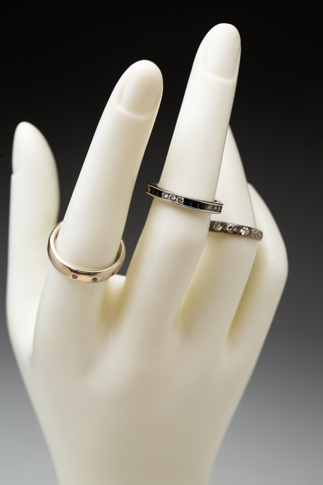 THREE VINTAGE BANDS WITH DIAMONDS. (1 of 2)