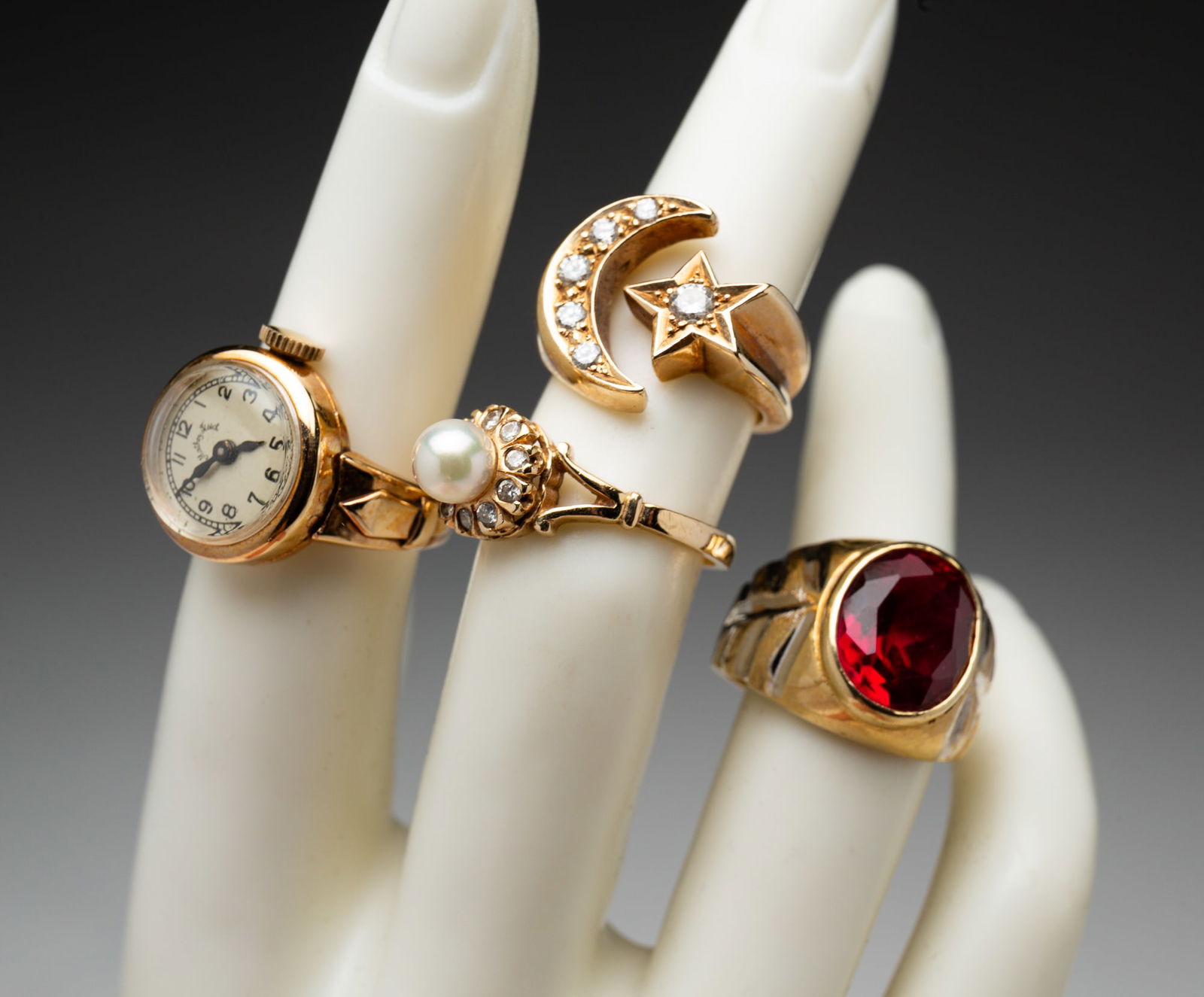 FOUR GOLD RINGS, INCLUDING A RING WATCH. (1 of 3)