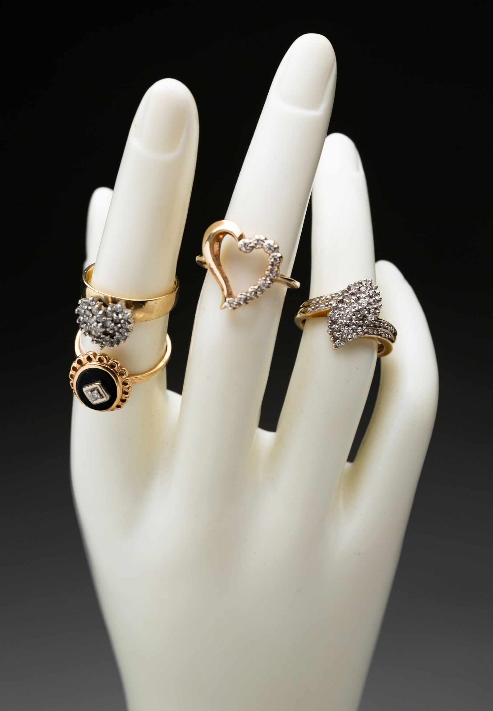 FOUR 10 KARAT YELLOW GOLD RINGS. (1 of 4)