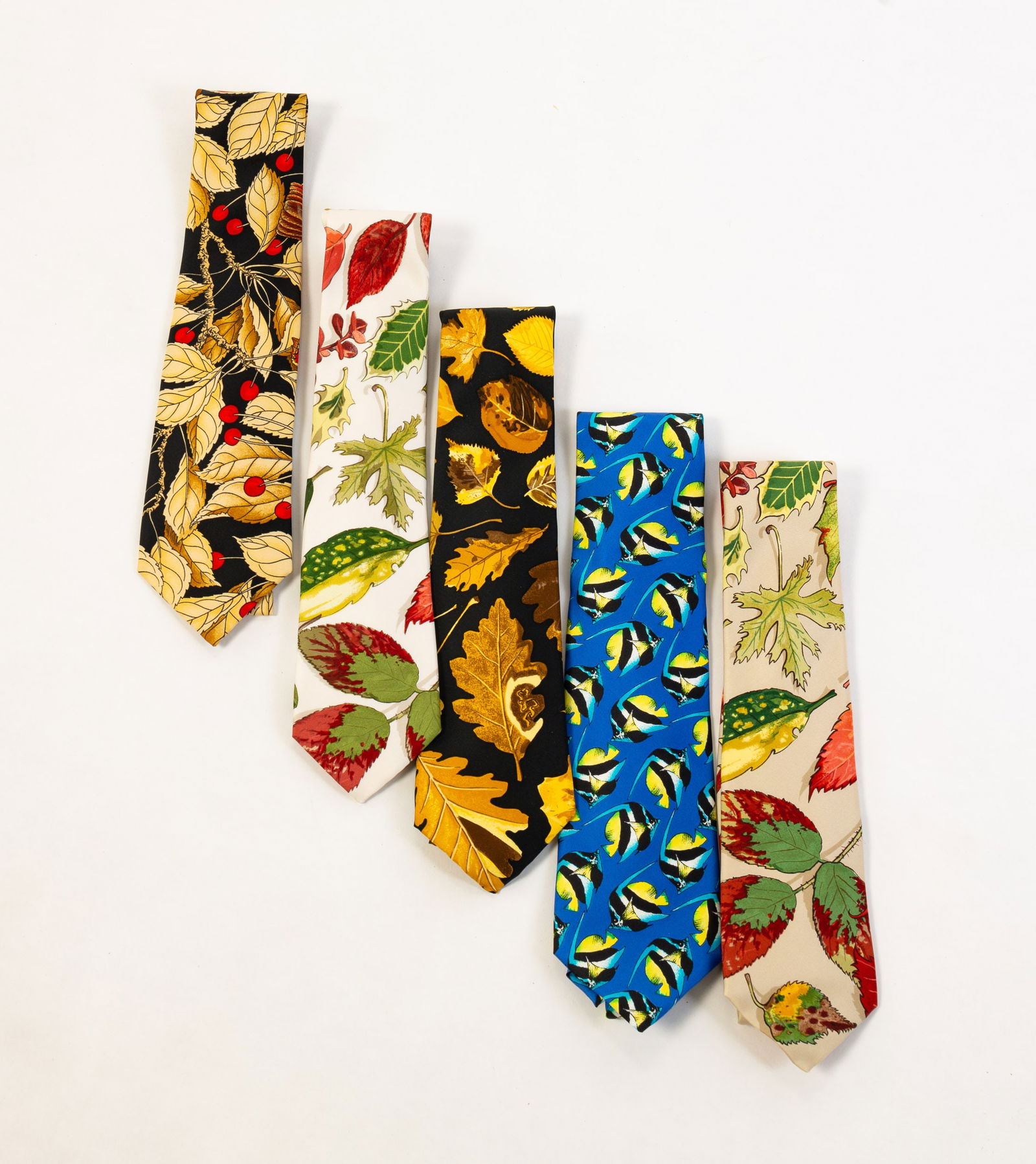 GROUP OF FIVE MEN'S SILK TIES BY HERMES AND ESCADA.: Silk. Hermes "Tourbillons" with black ground; Hermes "Tourbillons" with ecru ground; Hermes "Tourbillons" with ivory ground; Hermes with leaves, birds and berries on black ground; and Escada blue grou