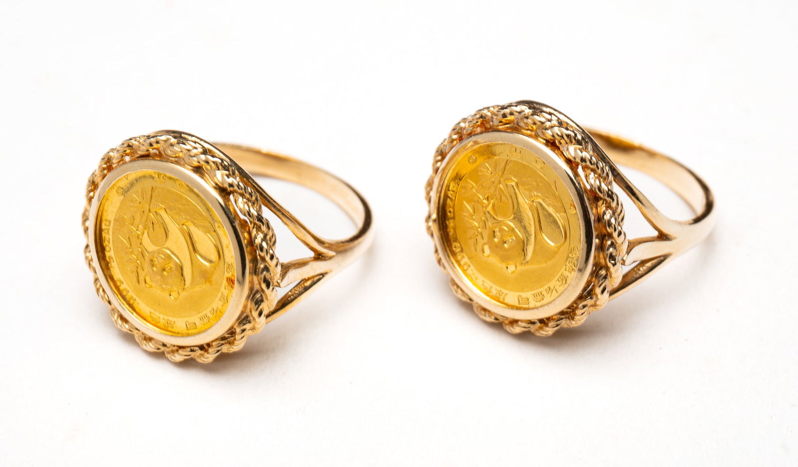 TWO 14K YELLOW GOLD CHINESE PANDA COIN RINGS. (1 of 2)