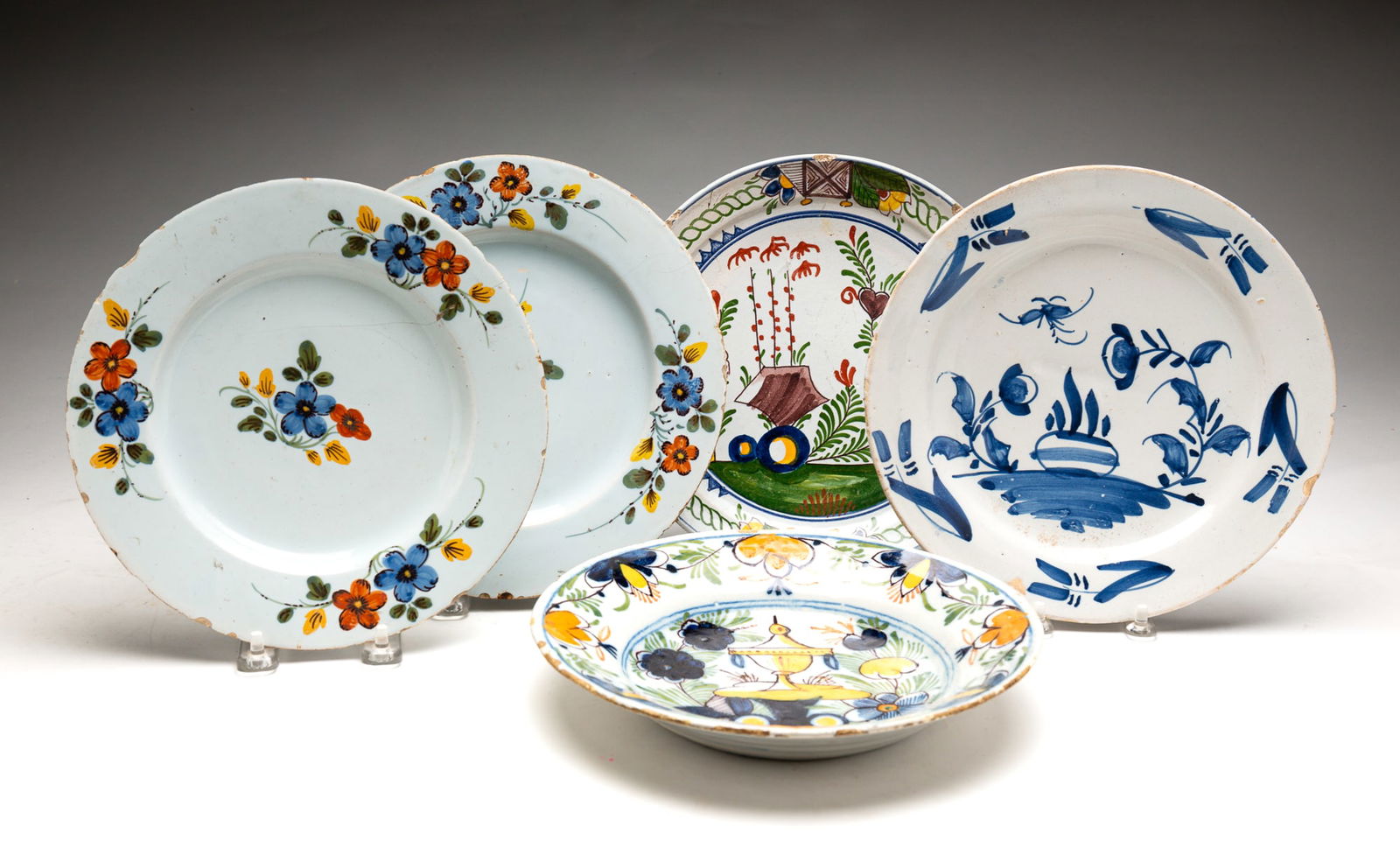 FIVE FAIENCE DELFT PLATES. (1 of 6)