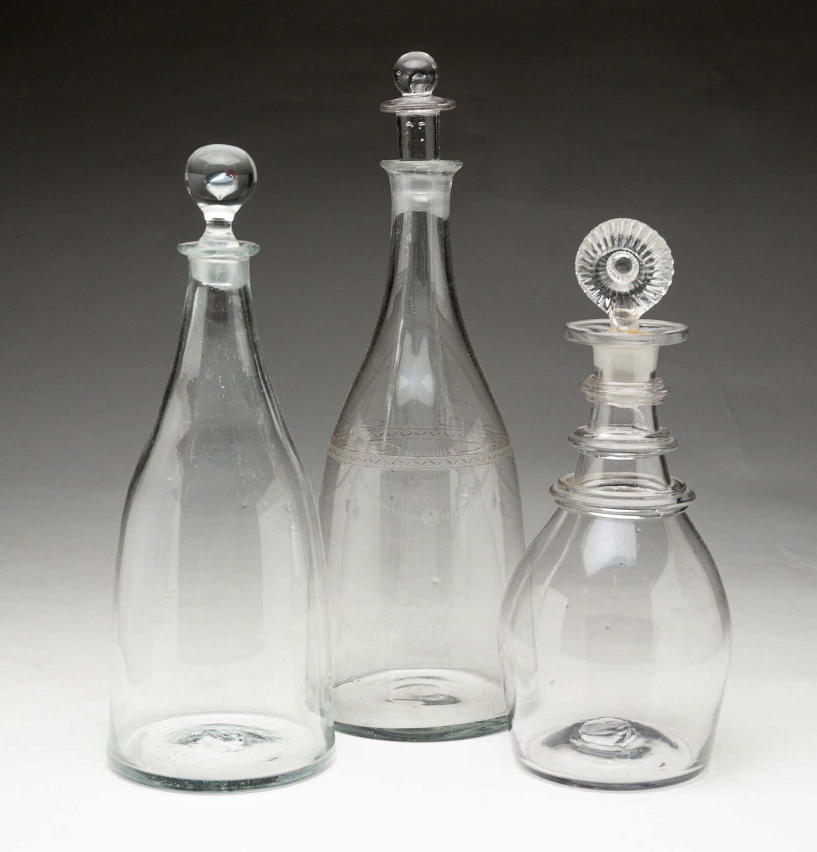THREE BLOWN GLASS DECANTERS. (1 of 7)