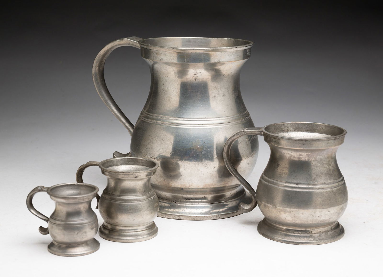 FIVE BELLIED PEWTER MEASURES. (1 of 10)