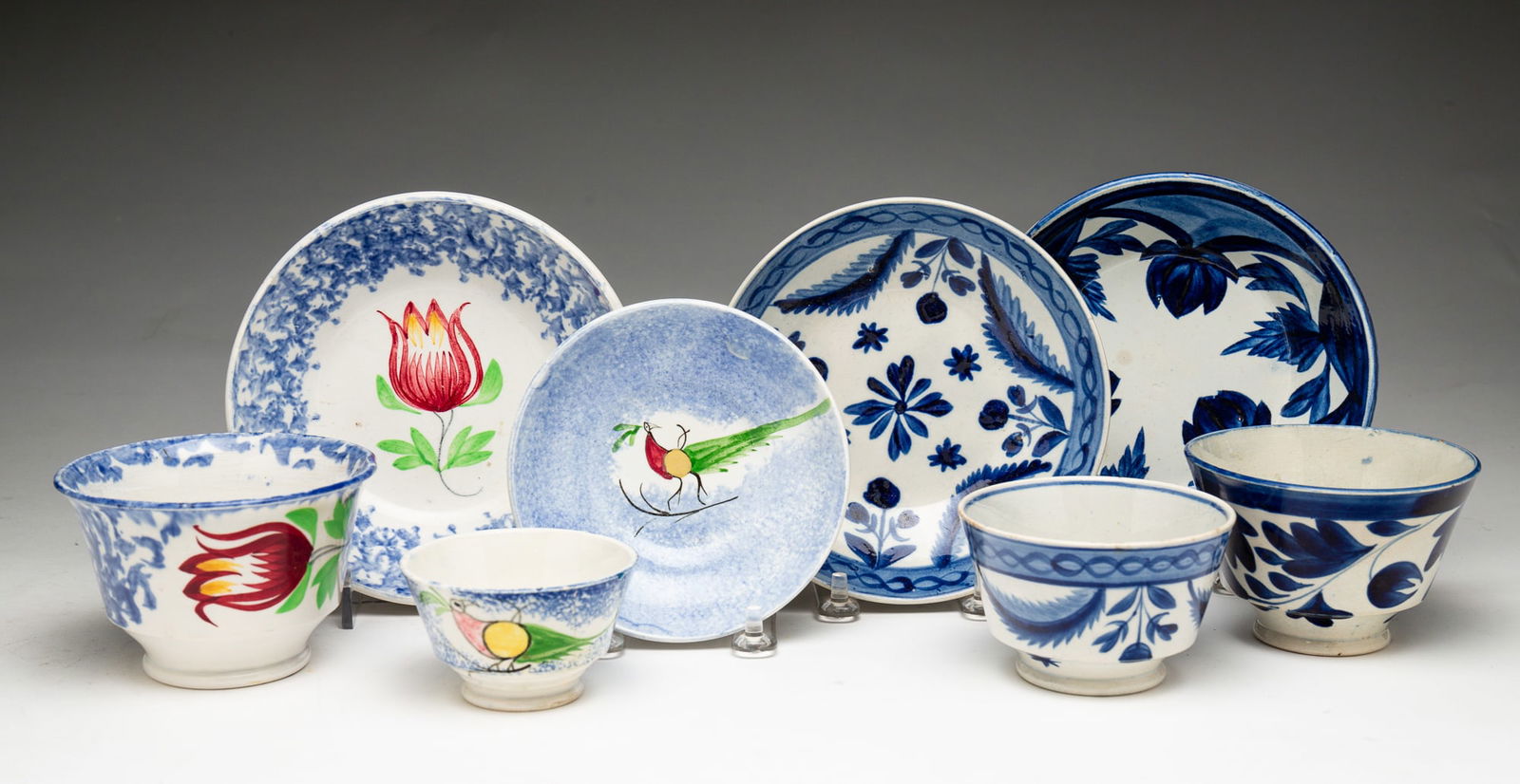 FOUR HANDLELESS CUPS AND SAUCERS. (1 of 4)