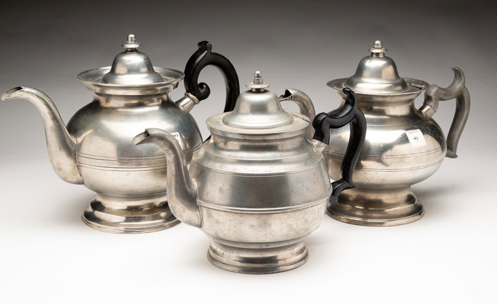 THREE BELLIED PEWTER TEAPOTS. (1 of 6)