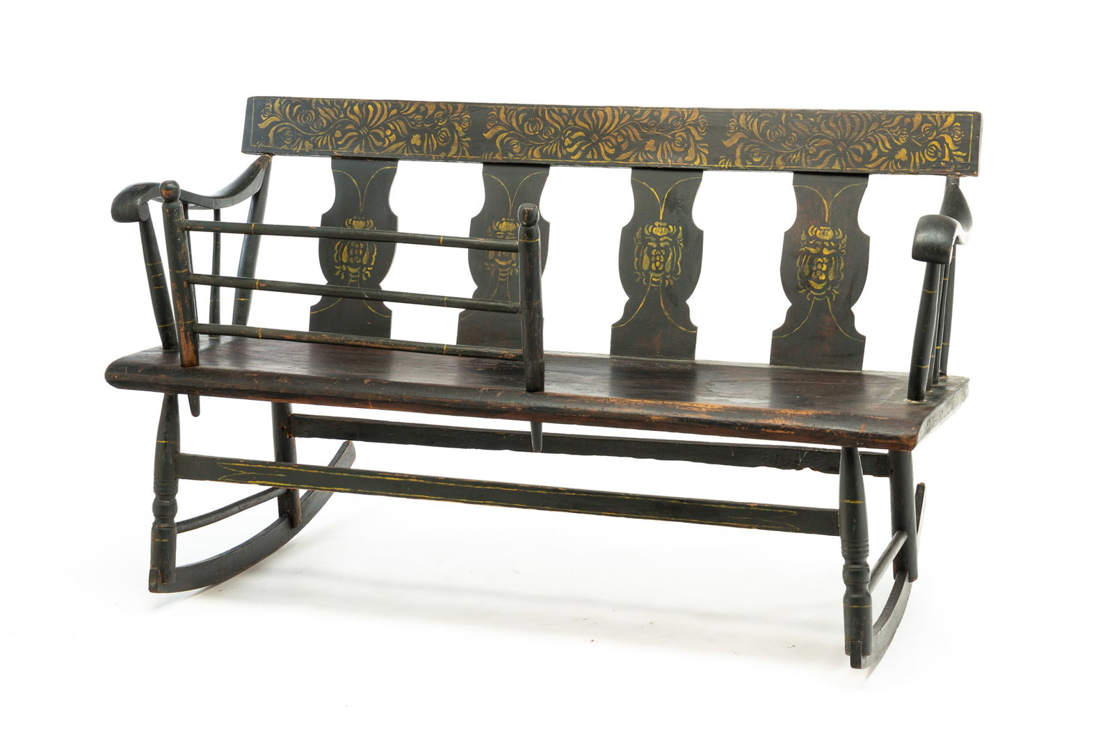 STENCIL DECORATED MAMMY'S BENCH.: American, second quarter 19th Century. Mixed woods. Plain crest, vase shaped splats, rolled arms, slat stretcher and simple turnings. Worn black paint and yellow floral stenciling. Some wear and repai
