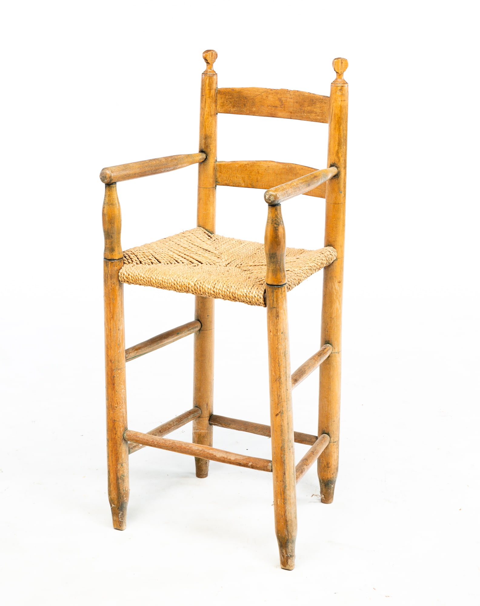 LADDERBACK HIGH CHAIR.: American, fourth quarter 19th Century. Slat back, replaced rush seat. Some wear. 20"seat ht. 34.5"h.