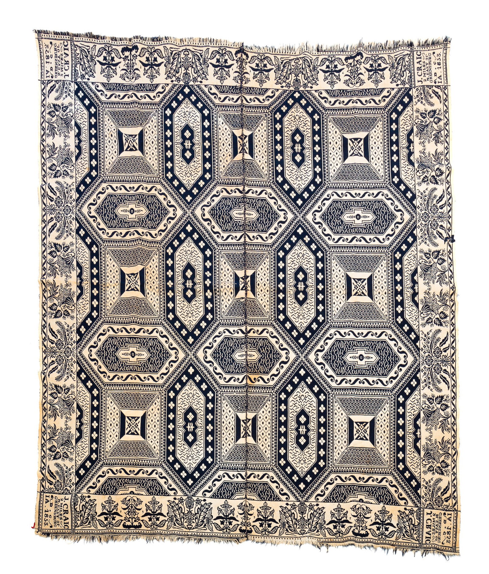 INDIANA JACQUARD COVERLET BY JAMES CRAIG.: American (Indiana / Decatur County), mid-19th Century (1853). Blue and white. Geometric field with floral border. Corner block reading "J. CRAIG/2 MILES/N. EAST OF/GREENSBURG/DC/IA. 1853". Some staini