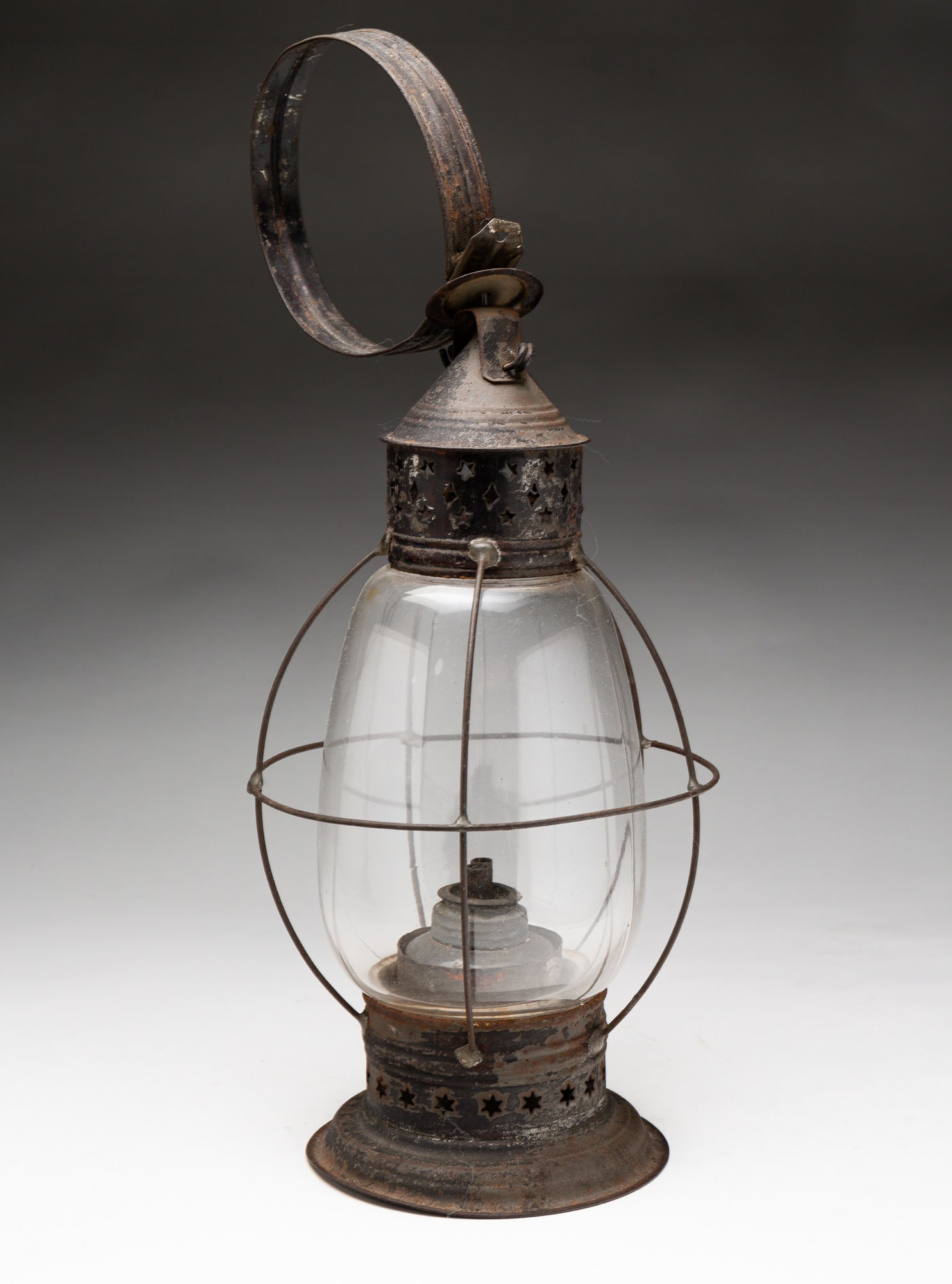 TIN AND BLOWN GLASS LANTERN.: American, second quarter 19th Century. Die punched top and tin ring top and double whale oil burner. 15.5"h.