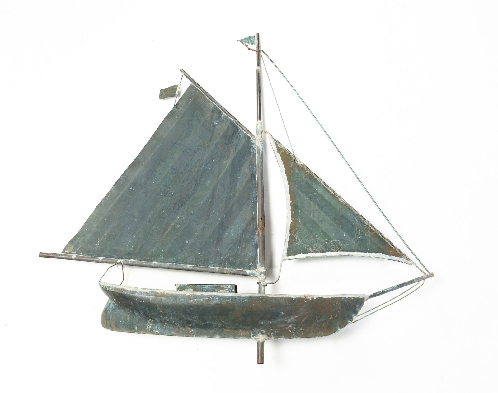 SAILBOAT WEATHERVANE.: American, 20th Century. Copper. In the shape of a sloop. Two flags, two sails, doghouse on deck and wire rigging. Oxidation and splits in brass mast. 36.5"h. 37"l. 5.5"d.