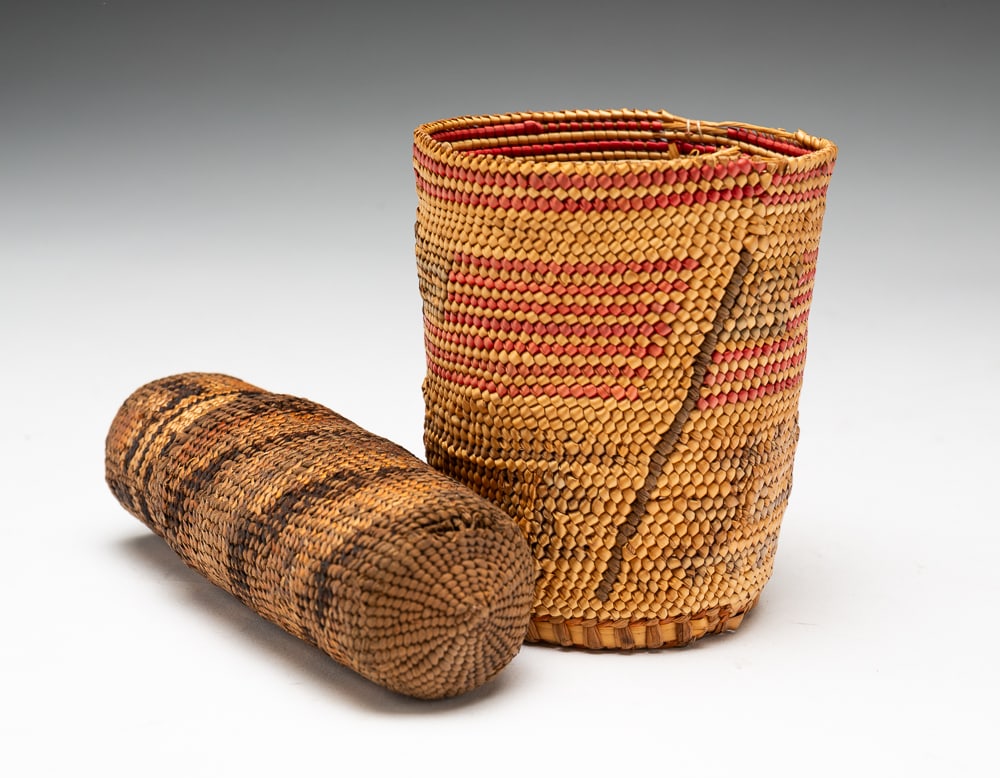 TWO NORTHWEST COAST BASKETS.: One Nootka / Makah and one Tlingit, first half 20th Century. Cup with three American flags. Small break to top and fading to design. 3.5"h. Eyeglass carrying case in two parts. 5"l.We do not guarantee