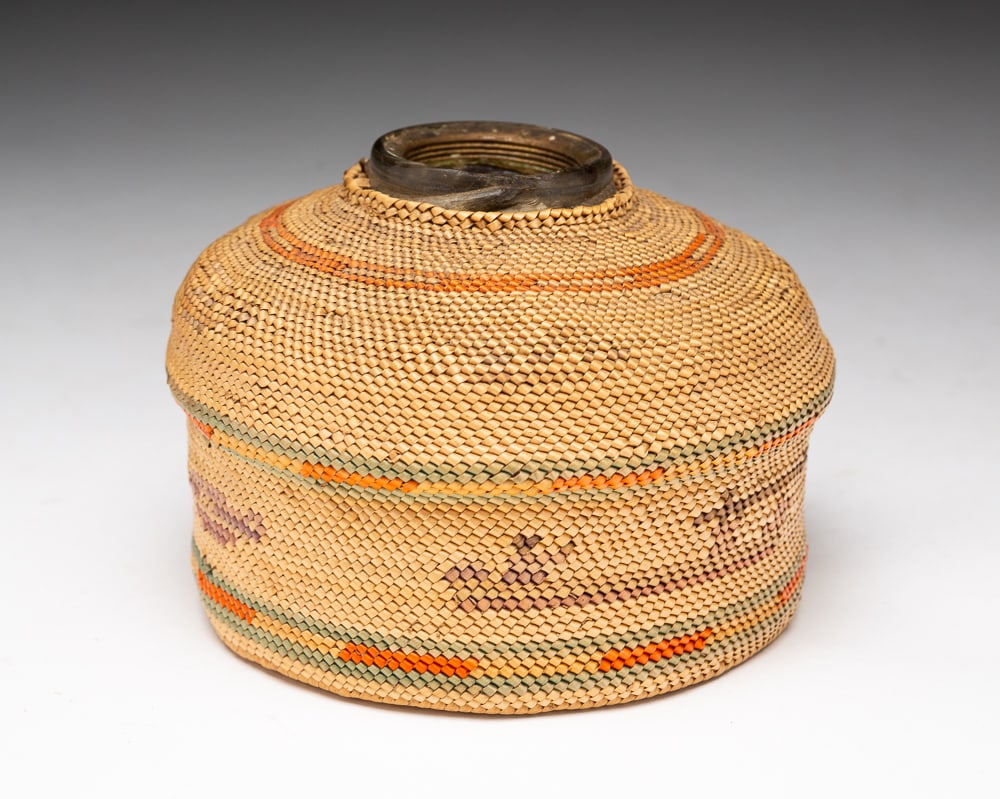 MAKAH PICTORIAL INKWELL WITH WOVEN COVERING.: Makah, early-20th Century. Woven basket covering with unusual whale or orca designs with figural elements. Overall good condition with minor fading. 3"h. 4.5"dia.We do not guarantee tribal attribution