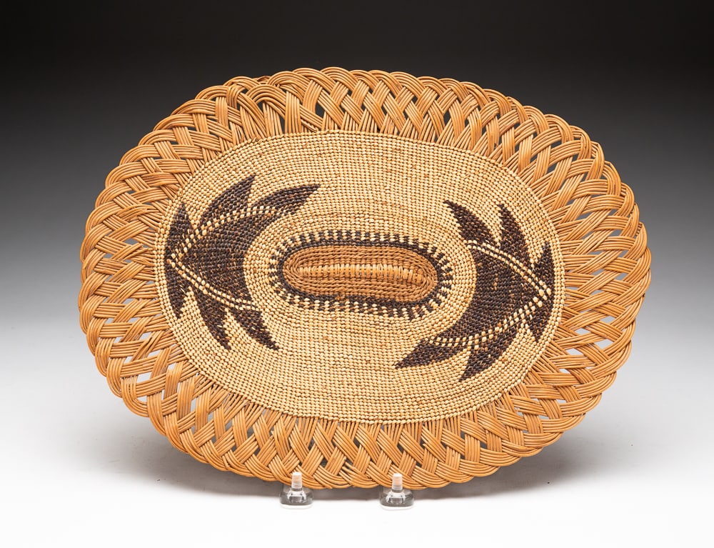 SMALL HUPA BASKET TRAY.: Hupa, early-20th Century. Willow woven edge. Overall good condition. 10"w. 13"l.We do not guarantee tribal attributions for American Indian / First Nations items.