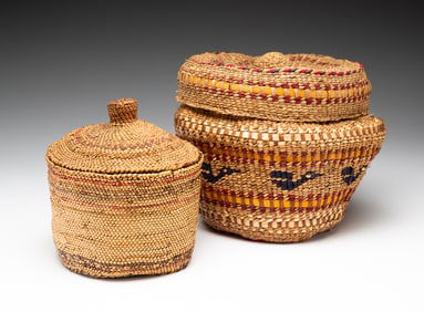 TWO NORTHWEST COAST PICTORIAL LIDDED BASKETS.