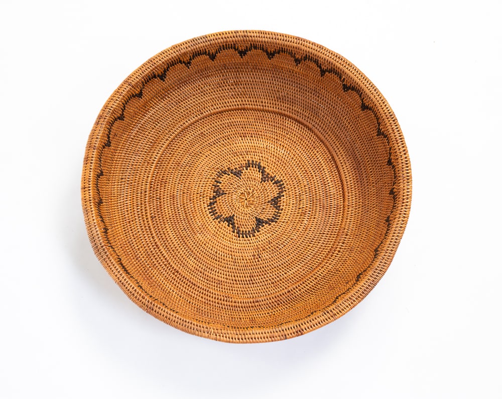 UNUSUAL ESKIMO BASKET BOWL.: First half 20th Century. Fine weave with overhanging lip and step down construction. Excellent condition. 3"h. 13"dia.We do not guarantee tribal attributions for American Indian / First Nations items.