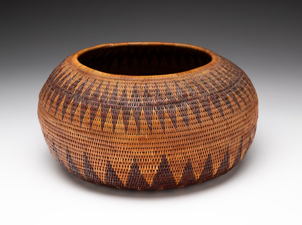 VERY FINE CALIFORNIA BASKET/BOWL.: Late-19th or early-20th Century. Dark red and black diamond zigzag pattern. Appears to have a thin coat of varnish on bottom. Overall good condition. 4"h. 8.5"dia.We do not guarantee tribal attributio