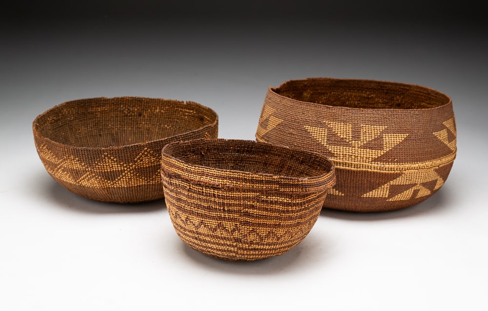 THREE FINE BASKETS, INCLUDING HUPA.: Late-19th to early-20th Century. Two cooking bowls. Decorated throughout with repeating geometric motifs. Overall good condition with some rim damage. Large 4.5"h. 8"dia. Medium 3"h. 8"dia. Small 3.5"