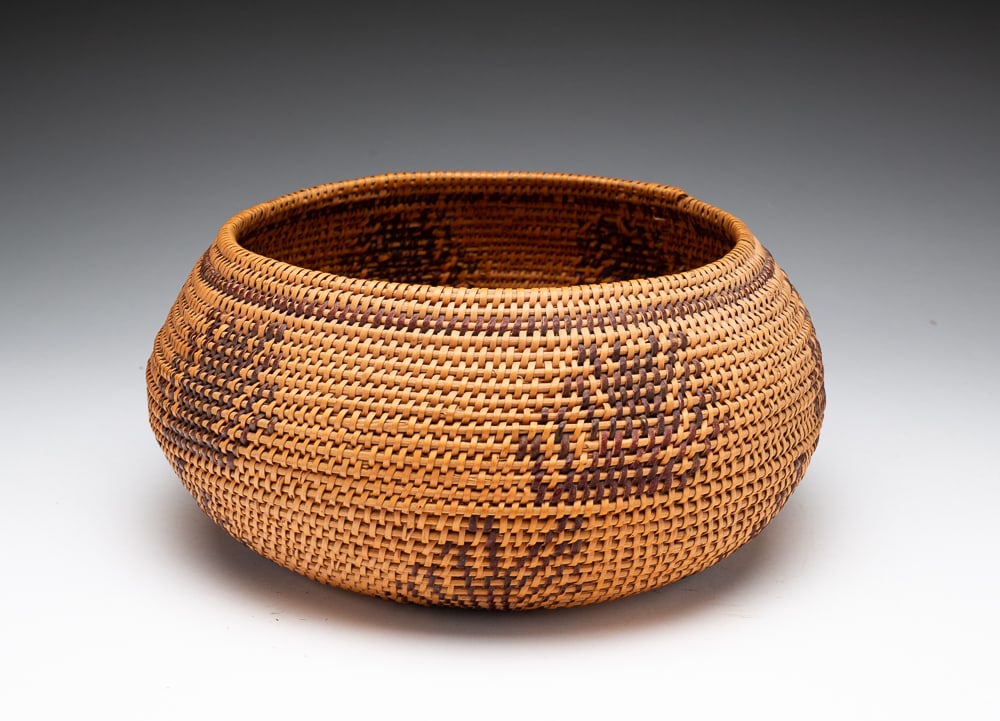 CALIFORNIA WASHOE BOWL.: First half 20th Century. Single-rod. Fine weave with with polychrome design. Excellent condition. 4.5"h. 9.5"dia.We do not guarantee tribal attributions for American Indian / First Nations items.