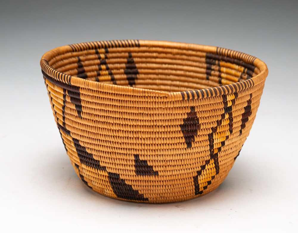 PANAMINT BASKET WITH YELLOW POLYCHROME.: Panamint, early-20th Century. Excellent condition. 3"h. 5.5"dia.We do not guarantee tribal attributions for American Indian / First Nations items.
