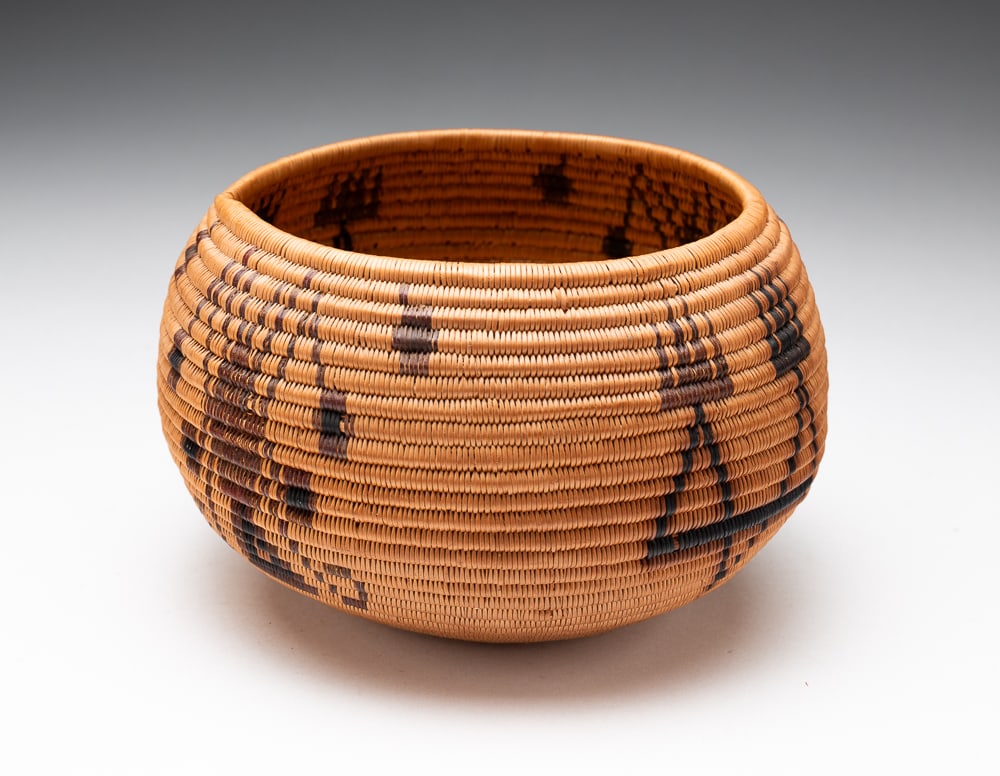 VERY FINE WASHOE BASKET.: Washoe, first half 20th Century. Great polychrome design. Excellent condition. 4"h. 6.5"dia.We do not guarantee tribal attributions for American Indian / First Nations items.