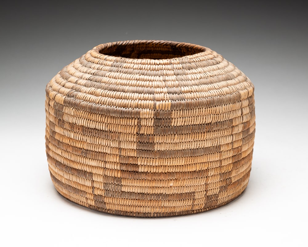 PIMA BASKET WITH GEOMETRIC DESIGN.: Pima, first quarter 20th Century. Geometric design running throughout. Overall good condition. 6"h. 9"dia.We do not guarantee tribal attributions for American Indian / First Nations items.
