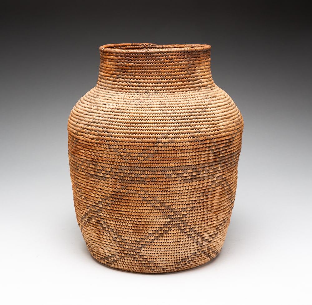 PIMA OLLA GEOMETRIC BASKET.: Pima, first quarter 20th Century. Willow and martynia. Diamond geometric designs. Good condition with water damage and some color loss. 12"h. 9"dia.We do not guarantee tribal attributions for American